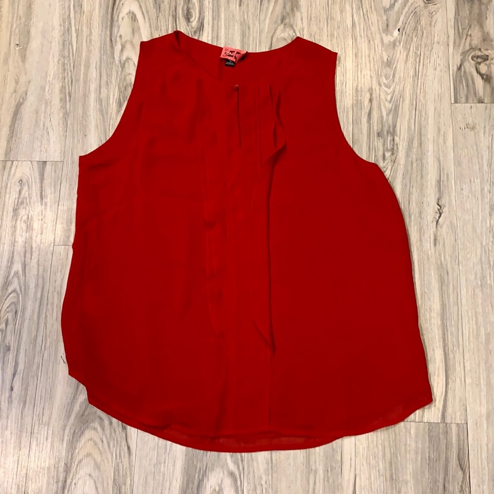 Red sleeveless flutter blouse